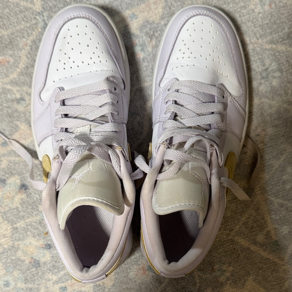 Nike Jordan’s. Women size 8.5. Lilac and gold. Great condition!!